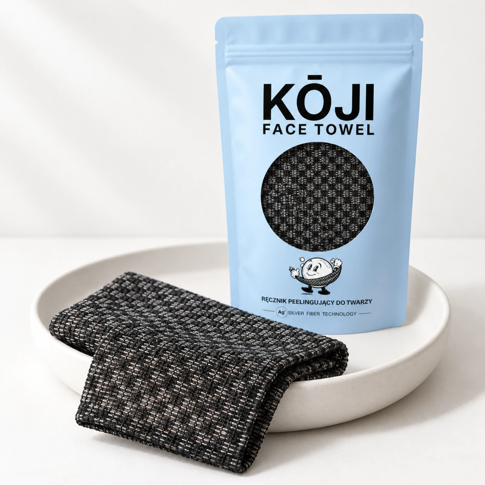 Opakowanie i ręcznik Kōji Face Towel na jasnej tacy